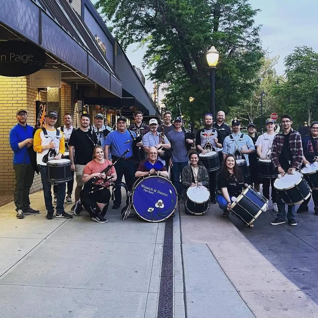Group photo of bagpipers after a flash mob performance in Grand Junction, Colorado